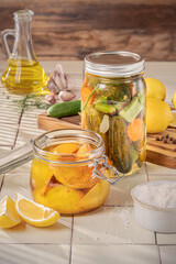 Organic pickled homemade lemon and cucumber jars.
Traditional way to keep vegetables and fruits for off season eating.