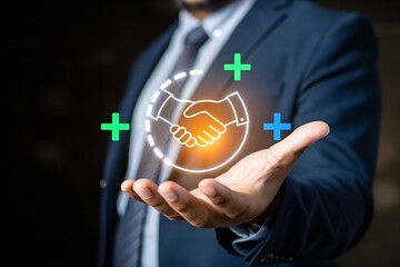Businessman holding a digital handshake icon with plus signs