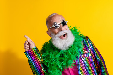 Photo of positive cheerful man wear stylish clothes feathers boa recommend empty space isolated on...
