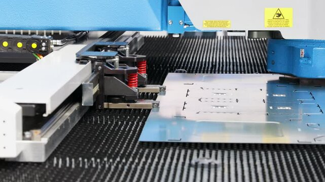 CNC punching machine processing a metal sheet in a modern factory, showcasing advanced industrial manufacturing, precision engineering and smart production technology