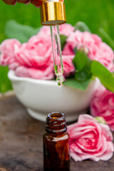 Rose essential oil in a bottle.essential oils.