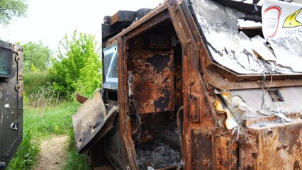 Rusty and burned-out armored vehicles on ukrainian territory. Exhibition of destroyed military...