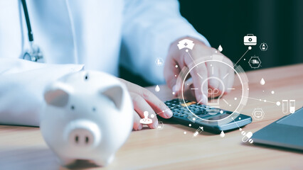 Doctors use a service fee calculator to save money on health insurance, drug cost concepts, Piggy...