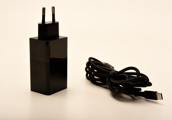 A new charger for gadgets with a wire. USB charging with a wire.