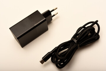 A new charger for gadgets with a wire. USB charging with a wire.