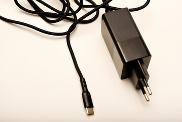A new charger for gadgets with a wire. USB charging with a wire.