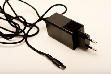A new charger for gadgets with a wire. USB charging with a wire.