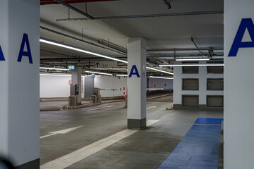Parking garage interior featuring modern design and clear signage for efficient navigation