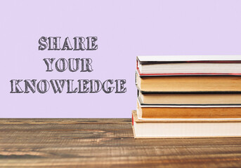Stack of books with the words share your knowledge written on top