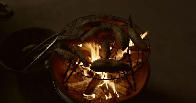 Traditional Fire-Roasted Sweet Potatoes on Open Flame