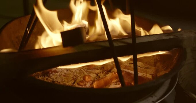 Traditional Fire-Roasted Sweet Potatoes on Open Flame