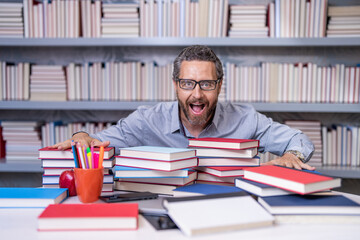 school professor with books. teachers day. amazed school teacher improve education in library....
