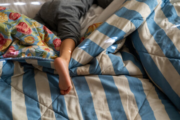Baby seen asleep in bed