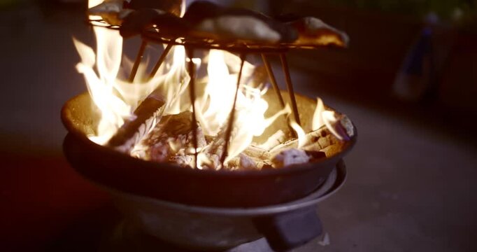 Traditional Fire-Roasted Sweet Potatoes on Open Flame