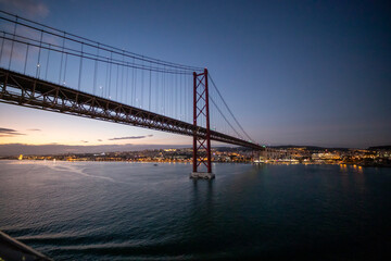 Lisbon Portugal  . Sunset view of the Tagus River in Lisbon from the deck of a cruise ship departing from the port in Alfama.