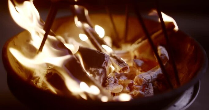 Traditional Fire-Roasted Sweet Potatoes on Open Flame