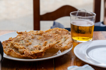 Delicious tortillas de camaron shrimps omeletts fried in olive oil typical snack in Andalusia Spain