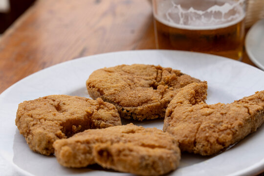 Delicious cazon en adobo fried in olive oil typical snack in Andalusia Spain