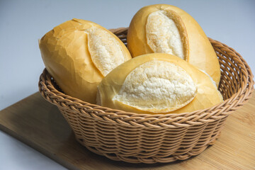 Bread on a white background with a round stone and a shadow
