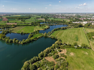 The serene aerial view provides a stunning perspective of lush landscapes and tranquil waters...