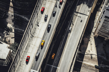 Aerial view of cars driving on a multi lane highway in a city