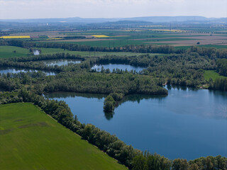Aerial View of Lush Green Landscape, Featuring Serene Water Bodies and Peaceful Nature Surroundings...