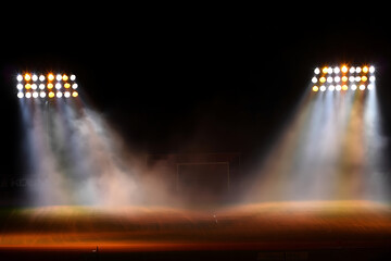 Dramatic Stadium Night Scene:  Twin Floodlights Illuminate Smoky Field,  Creating Atmospheric Stage.
