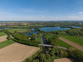 A stunning aerial view of a lush landscape filled with picturesque lakes and expansive fields...