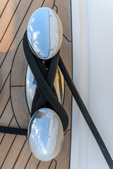 Bollard (cleat) with mooring line on superyacht. Mooring gear on yacht. Superyacht equipment. Top view.