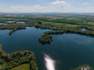 A Beautiful Aerial View of a Serene Lake Surrounded by Lush and Vibrant Greenery Koldinger Seen...