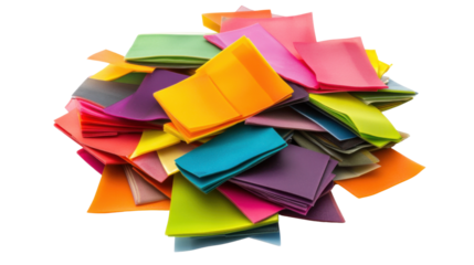 Assorted colorful sticky notes piled together on white background