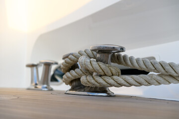 Bollard (cleat) with mooring line on superyacht. Mooring gear on yacht. Superyacht equipment. 