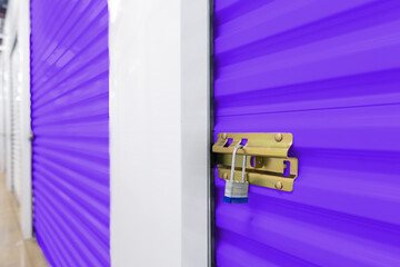 Key lock on colorful purple self storage door