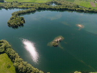 A Beautiful Aerial View of a Calm and Serene Lake, Surrounded by Lush Greenery and Nature Koldinger...