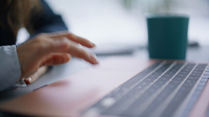Finger touching laptop surfing internet workplace closeup. Businesswoman working