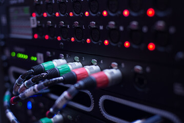 Close-Up of Audio Rack Equipment with Cables and Signal Lights