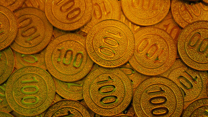 Gold coins and investment in the gold market, a tool to show wealth and financial stability.