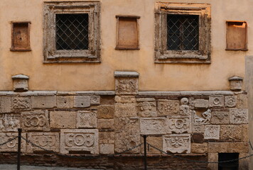 Sepulchral inscriptions and reliefs from sarcophagi and urns embedded in the Renaissance-style...