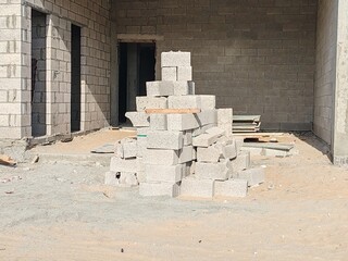 Obraz premium Block or Tabook, Concrete block on construction site, Cement blocks pallet. Cement bricks for building construction. Concrete block or cement block on construction site used for construct villa's