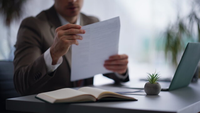 Businessman hands typing computer in office closeup. Manager finding mistake