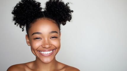 Young woman with curly puffs smiling