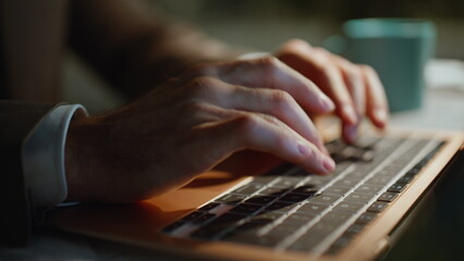 Night worker fingers typing keyboard online research closeup. Unknown manager