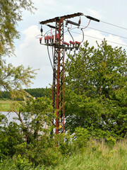 Rural power line pole with insulators and cables on Usedom island Germany