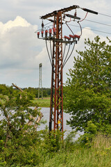 Rural power line pole with insulators and cables on Usedom island Germany