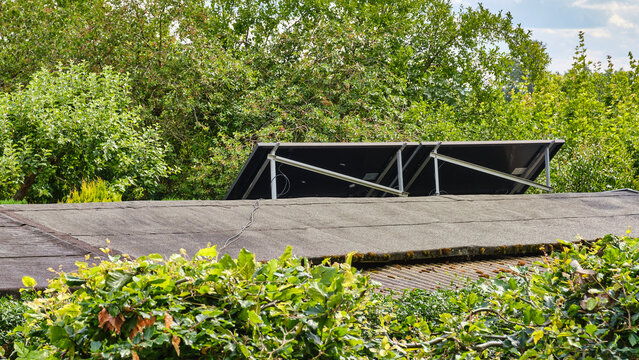 Solar Panels Installed On Shed Roof Near Residential House At Tollense Lake