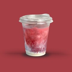 Iced creamy red velvet drink in clear plastic takeaway cup