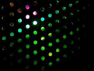 abstract background and textures, rows of circular lights sit against a dark background