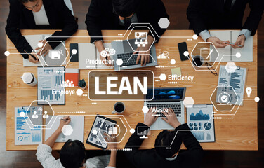 A business meeting showcasing a team analyzing data and discussing lean principles for improving...