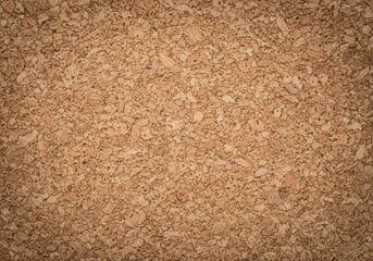 Natural Cork Board Surface Background. Close up of an eco friendly granulated material, perfect for notice boards or as a versatile neutral backdrop. Symbolizes organic simplicity and sustainability.