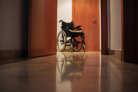 Empty wheelchair at home. Accessibility for patients with reduced mobility.